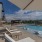 Resort-style infinity swimming pool with panoramic mountain views.