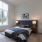 Spacious bedroom with generously sized windows and natural light.